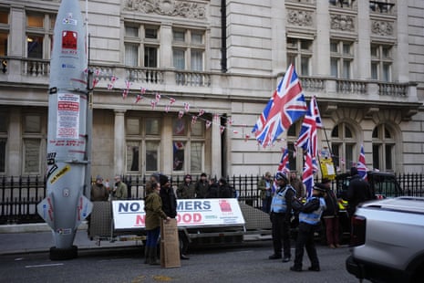 Farmers take part in a protest with their tractors in Whitehall, London.