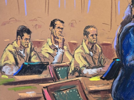 Courtroom sketch of Oren, Tal and Alon Alexander seated in yellow jumpsuits during sentencing