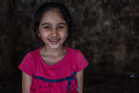 Portrait of a smiling girl in a pink top