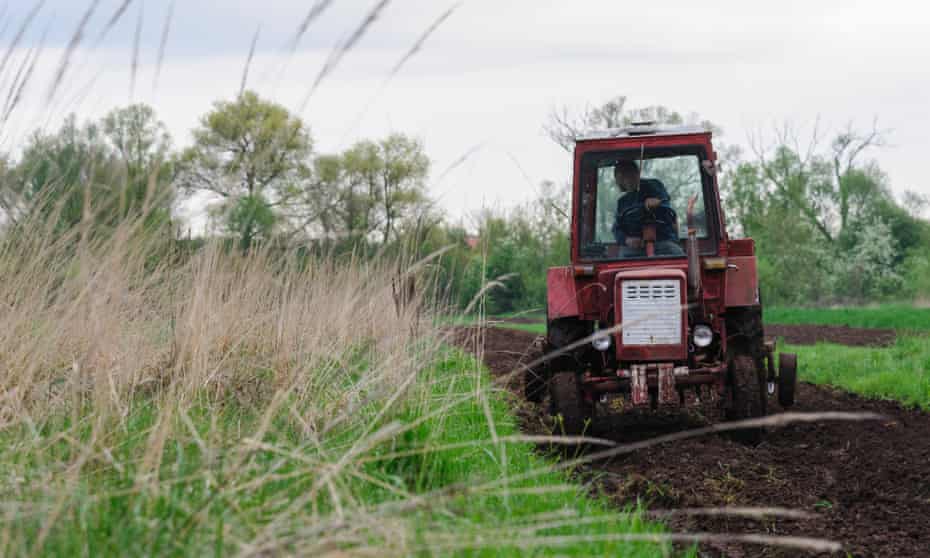 A farmer works on a field near Lviv, Ukraine.