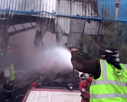 Firefighters extinguishing a fire after alleged Saudi-led airstrikes targeted a cement plant on the outskirts of Sanaa, Yemen.