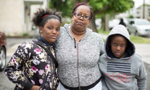 Kozette Green, center, and her twins Jerzey and Josh, nine. ‘My kids probably wouldn’t get as much as they do now. I think it’s horrible.’