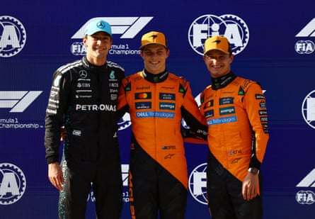 Oscar Piastri celebrates after qualifying in pole position with second placed Mercedes' George Russell and third placed McLaren's Lando Norris