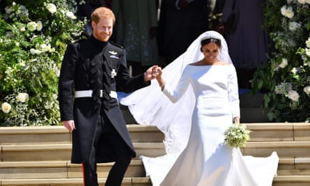 Prince Harry, Duke of Sussex and his wife Meghan, Duchess of Sussex emerge from the West Door of St George’s Chapel, Windsor Castle, in Windsor, after their wedding ceremony.