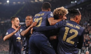 Manchester United celebrates its late winner as they have caused a rare home defeat at Juventus.