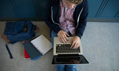 Teenager using laptop