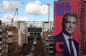 Joan Laporta’s electoral poster on the corner of Santiago Bernabéu Street, with Real Madrid’s stadium in the background.