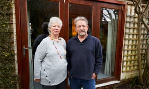 Peter Williams and his wife Mary with the tri-fold doors at their home