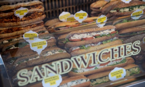 Sandwiches pictured through the shop window