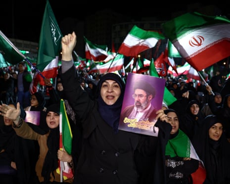 People attend an anti-US and Israeli rally in Tehran, Iran, on Sunday