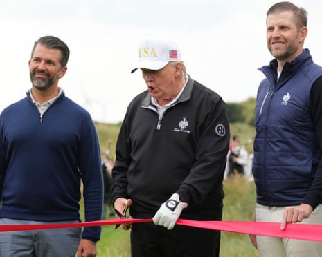 Donald Trump cuts the ribbon.