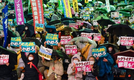 People hold a rally in Tokyo.