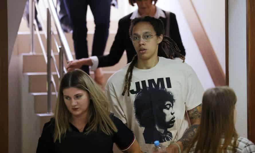 US basketball player Brittney Griner is escorted before a court hearing in Khimki outside Moscow, Russia.