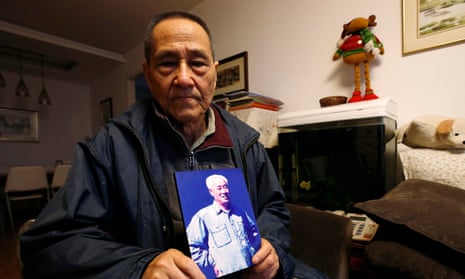 Bao Tong with a portrait of Zhao, which he kept in his living room, in 2015. 