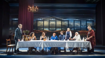 The cast of After Party sit at a long table