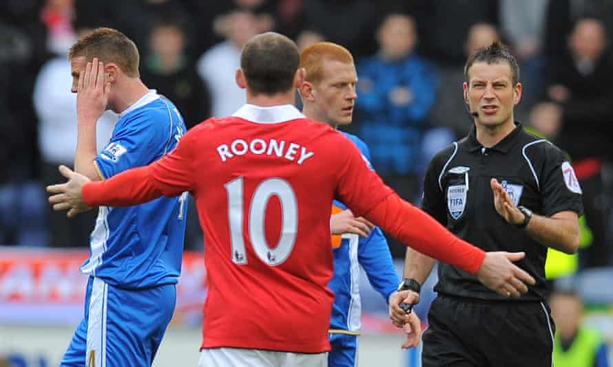 Wayne Rooney pleads innocence to Mark Clattenburg after he had clashed with Wigan's James McCarthy in 2011