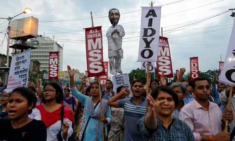 People shout slogans as they carry an effigy depicting Kuldeep Singh Sengar during a protest in Kolkata, India, on 31 July 2019.