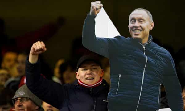 A Nottingham Forest fan with a Steve Cooper cutout.