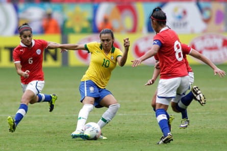 Brazil’s Marta, center, fights for the ball against Chile’s Daniela Pardo Moreno, right, and York Arriagada Bustos