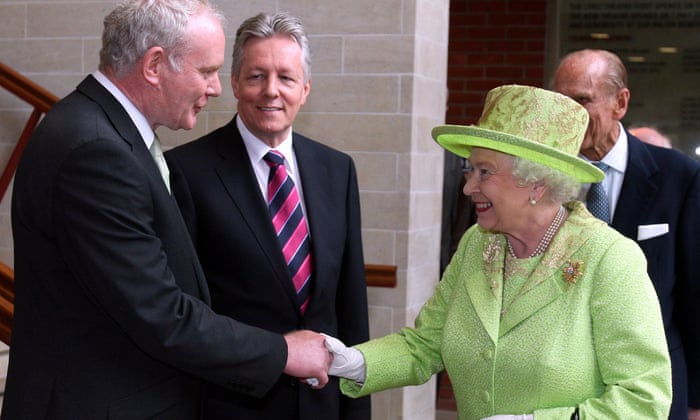 Queen Elizabeth II shakes hands with Northern Ireland Deputy First Minister Martin McGuinness.