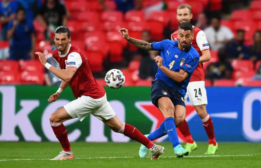 Leonardo Spinazzola passes the ball under pressure from Austria’s Florian Grillitsch during Italy’s last-16 victory.