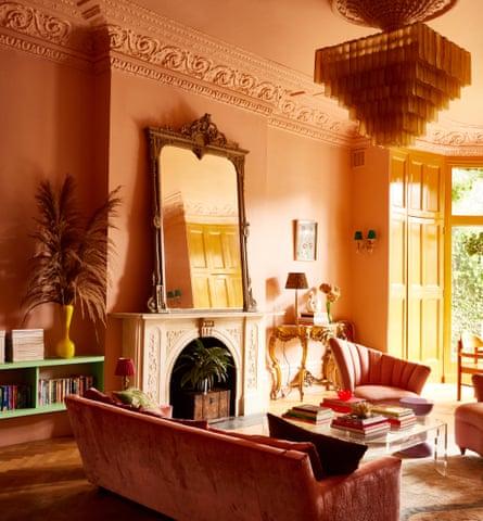 vintage furniture and a chandelier in her ornate living room.