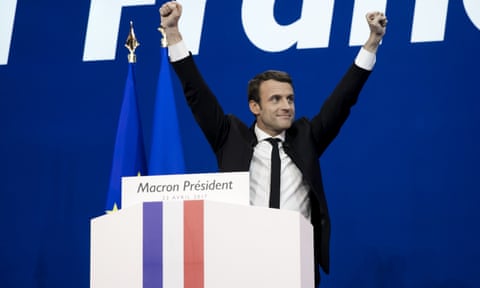 Emmanuel Macron celebrates after topping the first round of the French presidential election on Sunday.