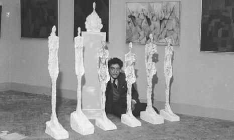 Alberto Giacometti with his plaster sculptures at the Venice Biennale