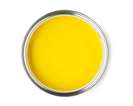 Overhead view of the top of a yellow paint pot.
