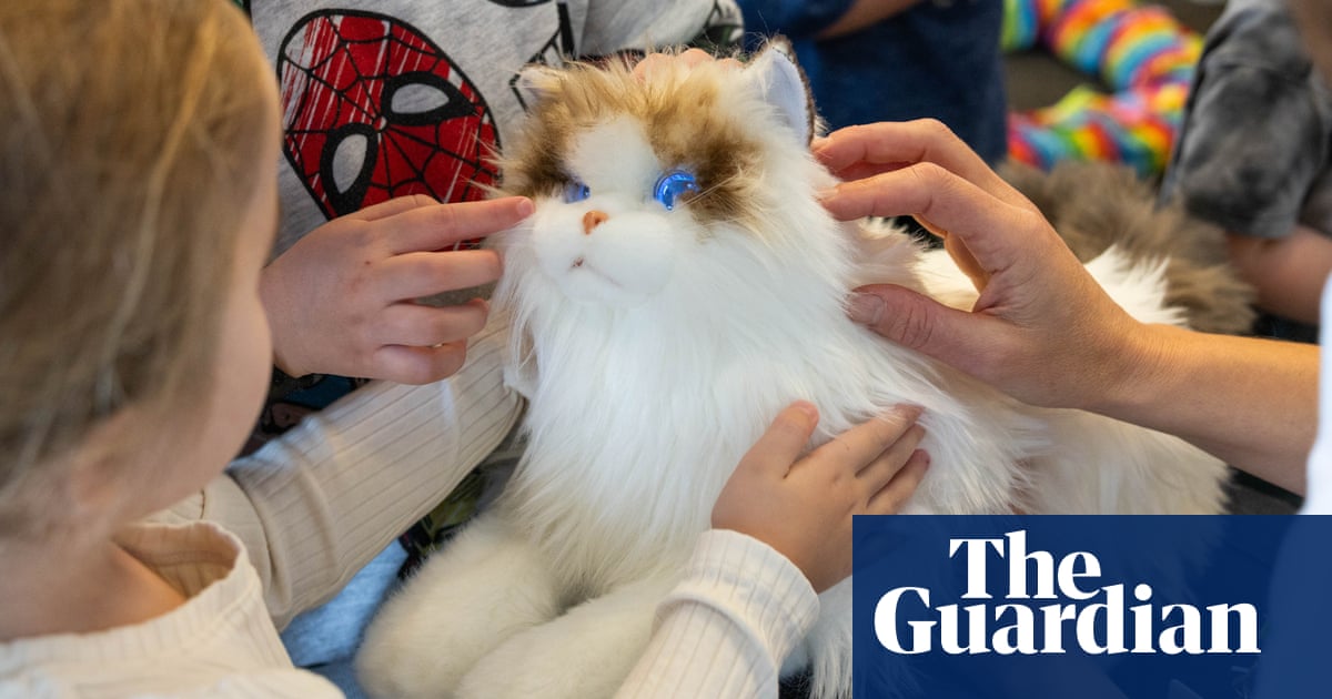 These robot cats have glowing eyes and artificial heartbeats and could help reduce stress in children