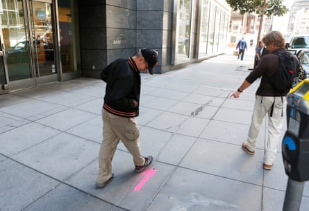 Pedestrians inspect cracks near the sinking Millennium tower in San Francisco in 2016.