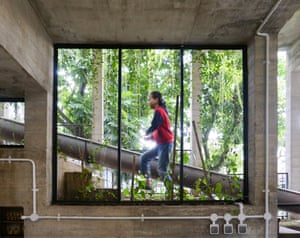 person seen through window walks up steps