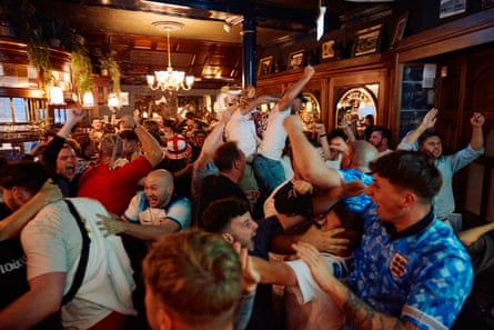 England fans celebrate at a live screening of the Uefa Euro 2024 final match between Spain and England in a London pub.