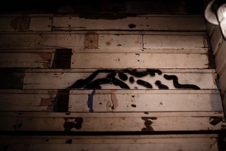 Wooden slats on a wall with disjointed patterns