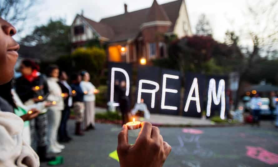 Protesters gather last year near illuminated letters spelling dream outside a house which they identified as the residence of Oakland Mayor Libby Schaaf.