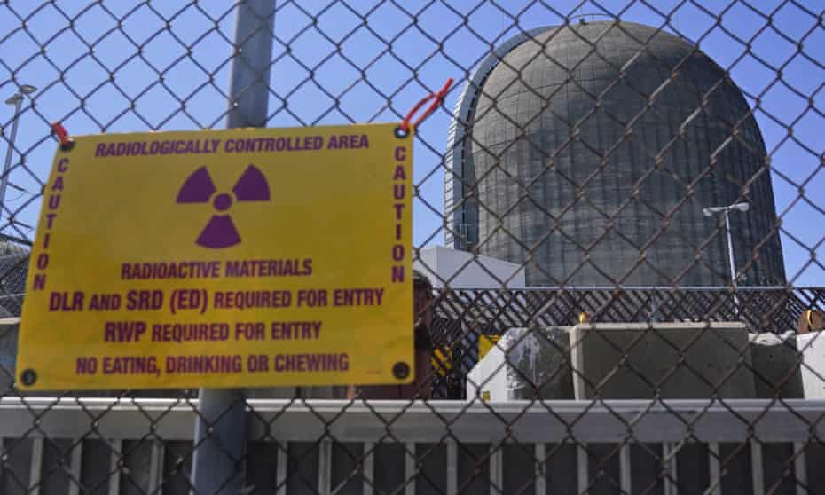 A sign on a fence warns of radioactive materials outside a nuclear reactor