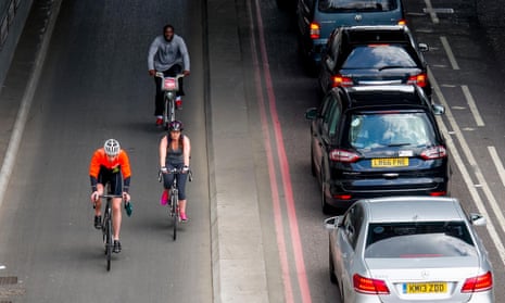 Cyclists using the TFL Cycle Superhighway in Upper Thames Street, London