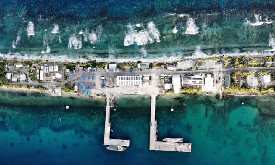 An aerial view of the port between the Pacific Ocean and lagoon on November 27, 2019 in Funafuti, Tuvalu. The low-lying South Pacific island nation of about 11,000 people has been classified as extremely vulnerable to climate change by the United Nations Development Programme. 