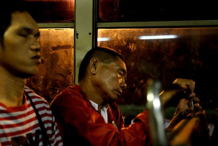 Alejandro Galasao, 58, street sweeper, sleeps on a bus