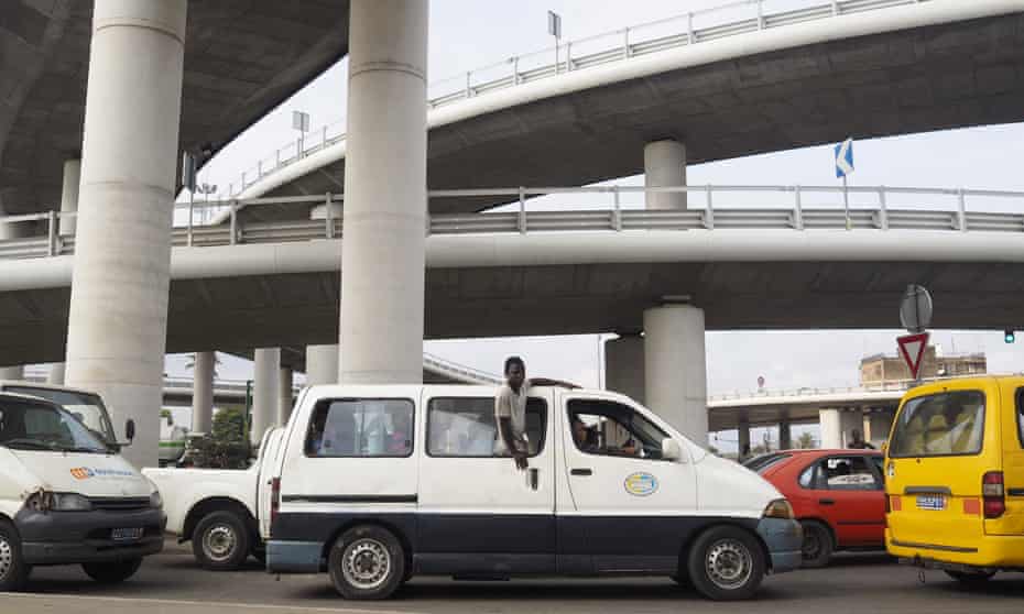 A van drives beneath the recently constructed Henri Konan Bedie bridge in Abidjan