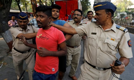 Members of the Dalit community are detained by police during a protest in Mumbai.