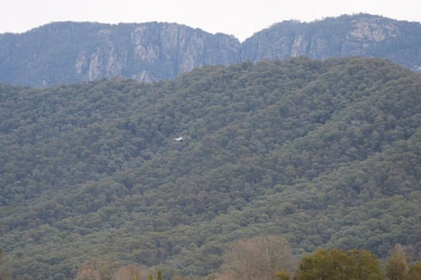 Helicopter above bushland