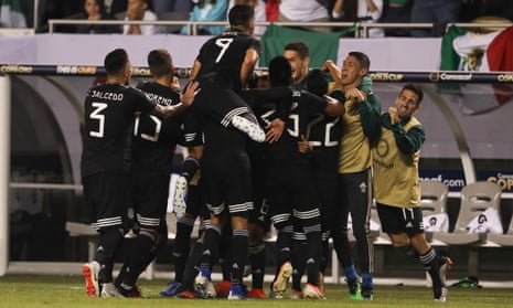 Jonathan dos Santos celebrates with his teammates after scoring the game’s only goal
