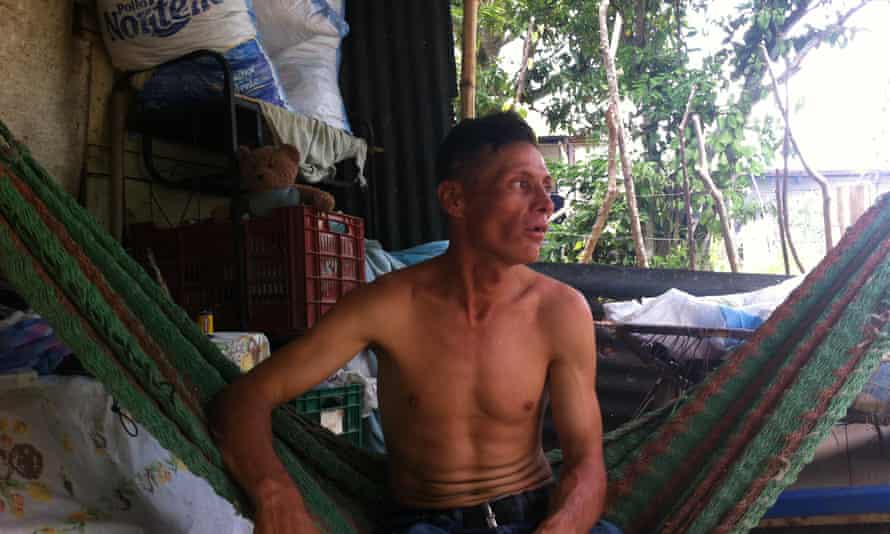 Hipólito Díaz, sits in a hammock at his home in July and remembers his brother El Chele