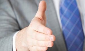 A person reaching out to shake hands 4619.jpg?width=300&quality=85&auto=forma