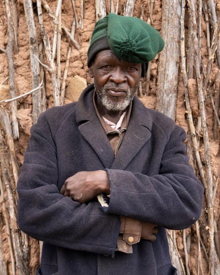 Tsotleho Mohale stands outside his home