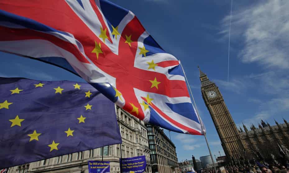 UK and EU flag outside parliament