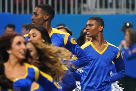 LA Rams cheerleaders Napoleon Jinnies, right, and Quinton Peron execute during Super Bowl LIII astatine Mercedes-Benz Stadium successful February 2019.