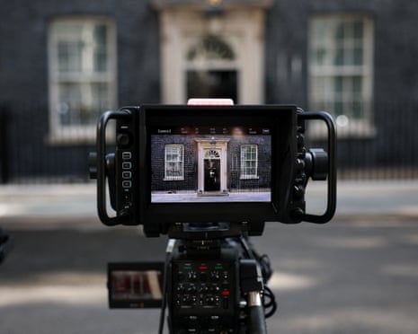 10 Downing Street's door is visible on a camera screen as members of the media gather on the day of the transfer of power from outgoing British prime minister Keir Starmer to Labour leader Andy Burnham, in London, Britain.