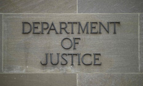 A "Department of Justice" sign on the wall of the US Department of Justice building in Washington, DC.